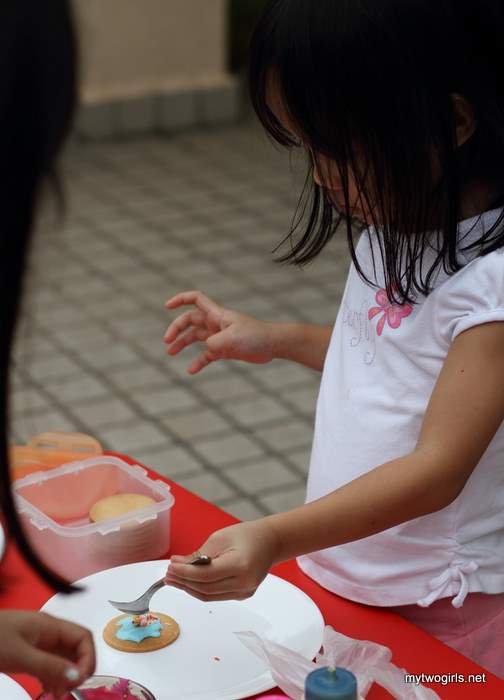 Moved on to her 2nd cookie